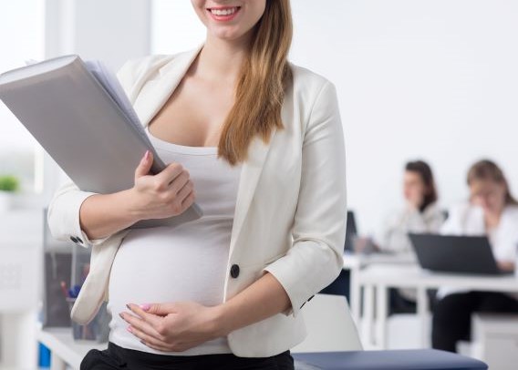 Smiling pregnant worker
