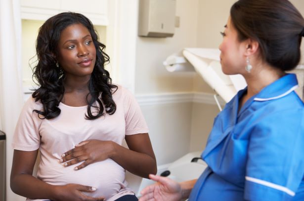 pregnant radiation worker consulting with radiation safety officer