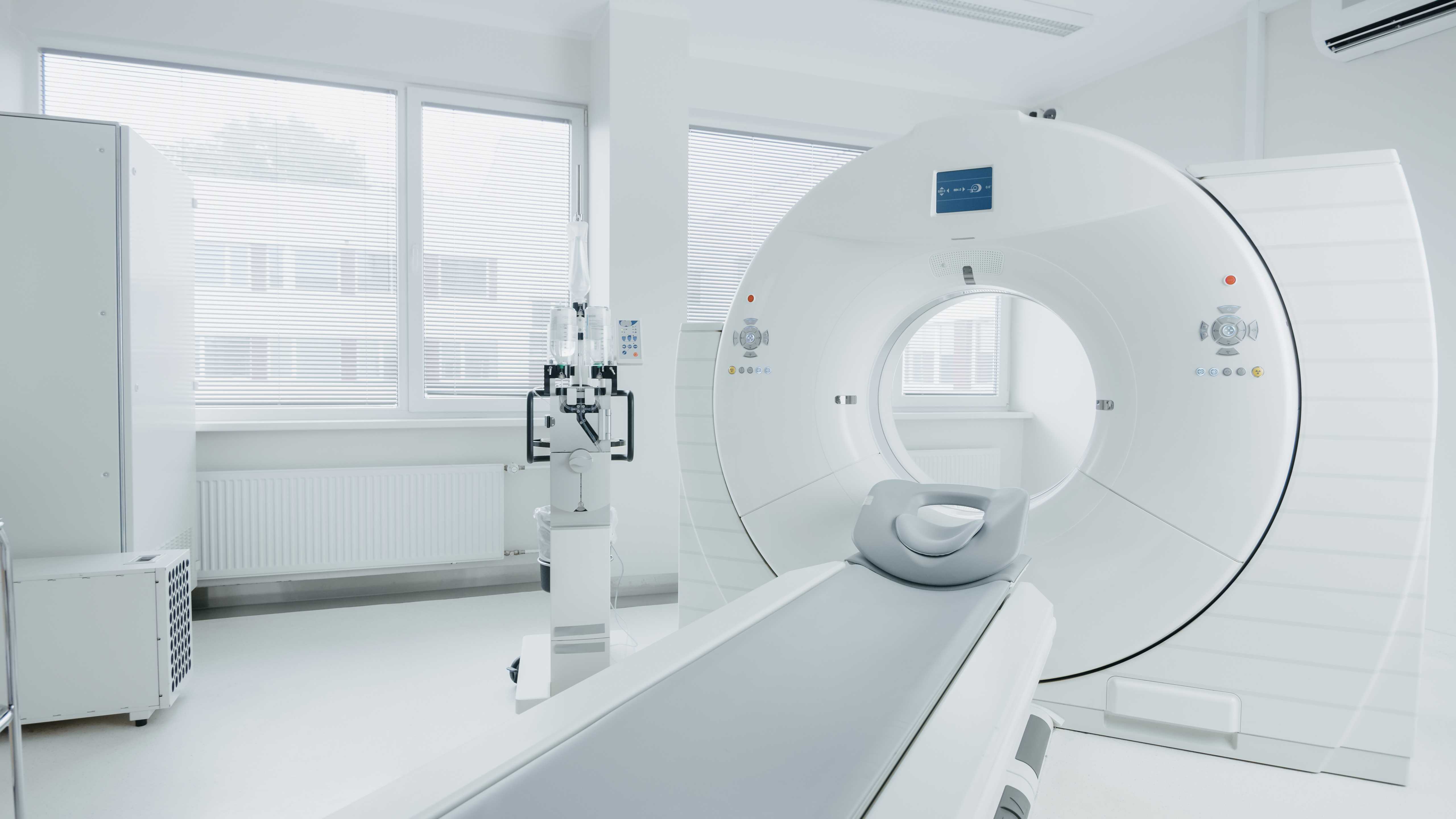 Medical CT or MRI or PET Scan Standing in the Modern Hospital Laboratory. Technologically Advanced and Functional Mediсal Equipment in a Clean White Room.